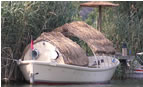 Thatched boat on the Dalyan estuary - click to enlarge image